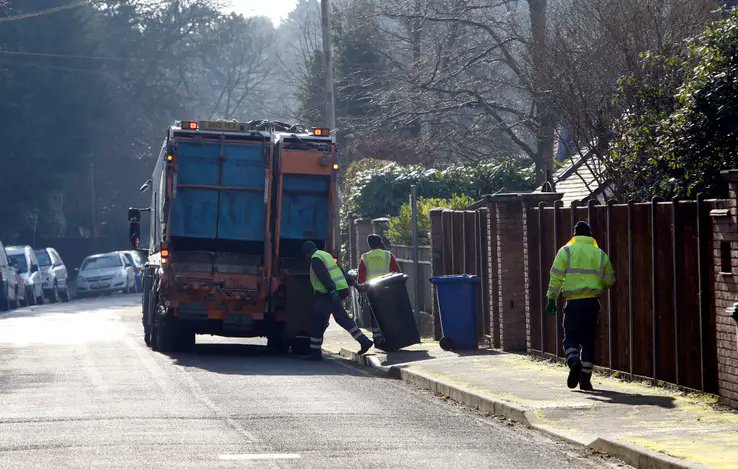 Article is about waste management so the image references a waste management team.